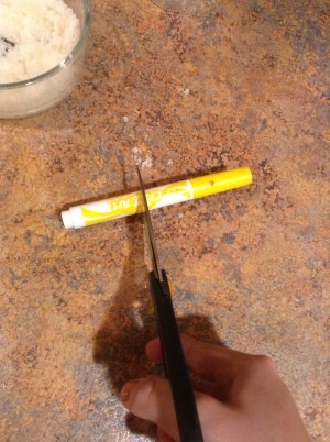 Cutting a yellow marker in half