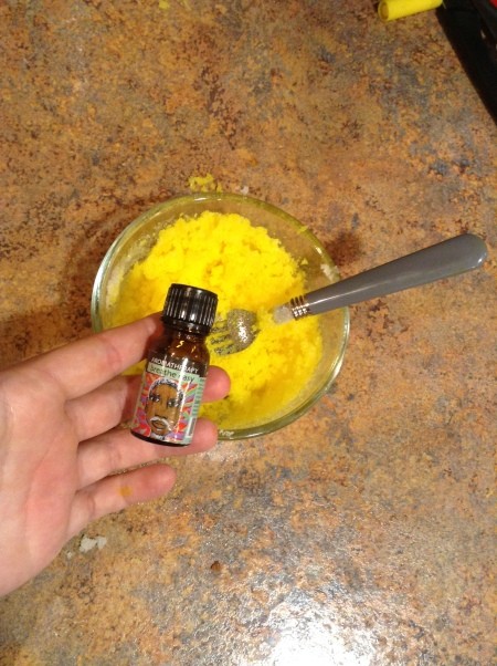 Aromatherapy Body Scrub - stirred mixture in bowl and ready to add essential oil from bottle