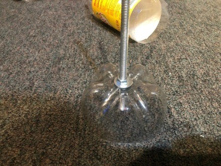 Upcycled Plastic Bottle Jewelry Stand - add a washer and nut on both sides of the bottle bottom