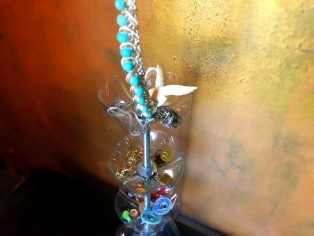 Upcycled Plastic Bottle Jewelry Stand - add jewelry