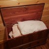 A Lane chest with linens inside.