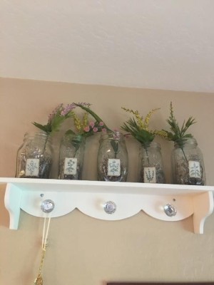 Decorative glass jars being used as vases.