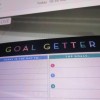 A pad of paper that says "Goal Getter" at the top.