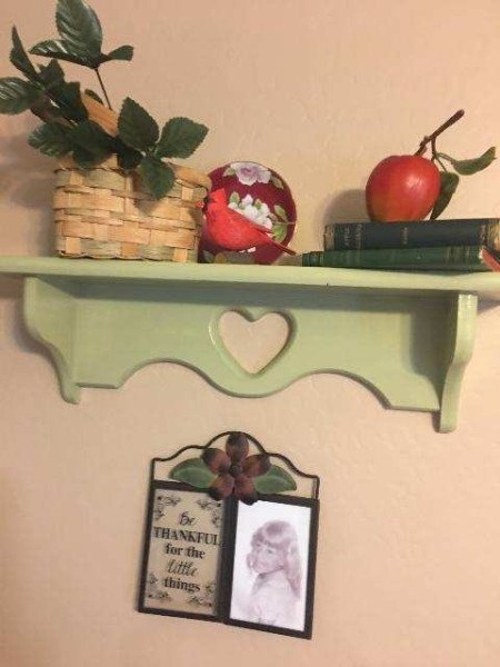 A close up of the green shelf.