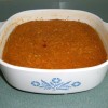 A completed pan of grated sweet potato pudding.