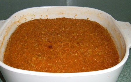 A completed pan of grated sweet potato pudding.
