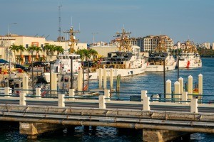 Several coast guard ships at a dock in Miami, FL.