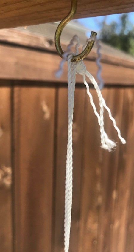 Hanging CD Reflective Garden Decoration - closeup of twine hanging from a cup style hook
