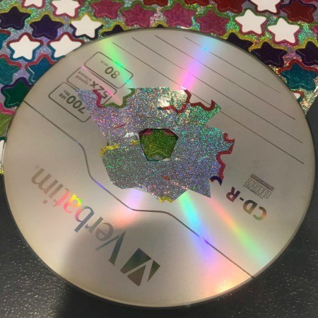 Hanging CD Reflective Star Room Decor - using sticker scraps to cover the center of the CD