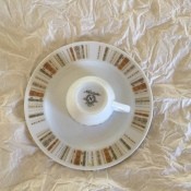 Identifying a Noritake Pattern? - upside down cup and white plate with earth tone rectangles around the outer edge
