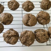 A cooling rack of baked muffins.