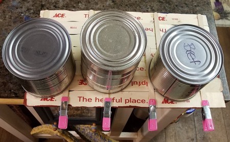 Wooden Stick Flag and Stars - clamps and cans holding down sticks while the glue dried