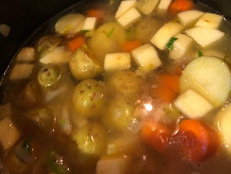 Cooking the curry in a pan.