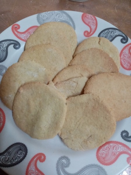 Baked sugar cookies on a plate.