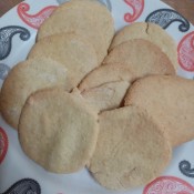 Baked sugar cookies on a plate.