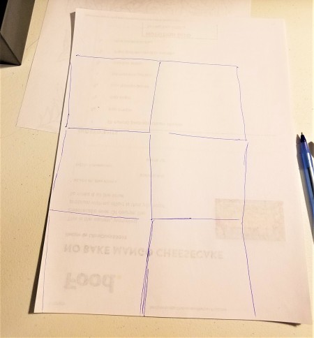 Marking out cutting lines for scraps of paper.