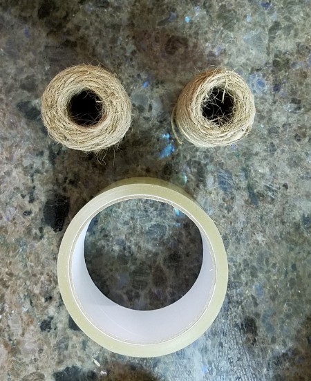 Two rolls or twine and a roll of tape.