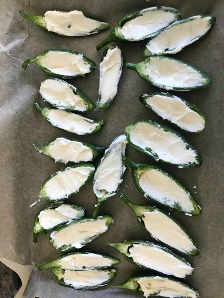 Jalapeño halves filled with cream cheese.