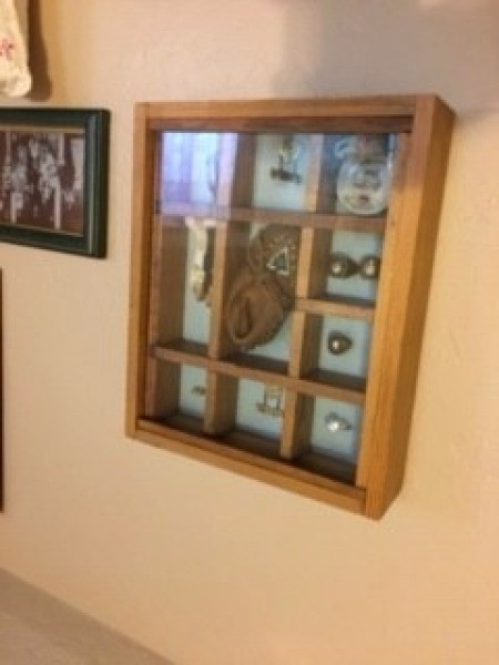 Shadowbox Displays - shadowbox hanging on the wall near a photo