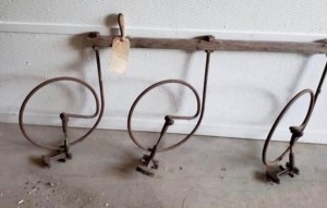 Identifying Old Farm Equipment? - three metal partial circles attached to a horizontal piece of wood