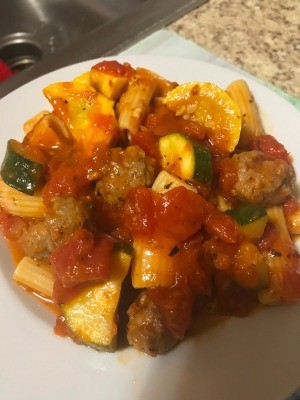 A plate of sausage rigatoni stew.