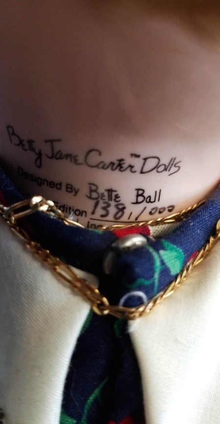Markings on the back of a doll's neck that says "Betty Jane Carter Dolls"