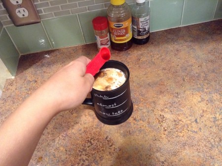 Adding vanilla to the milk mixture.