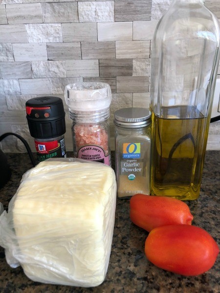 Ingredients for baked tomatoes with mozzarella.