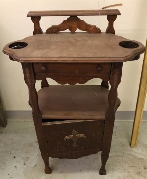 Value of an Antique Side Table? - antique table with two circular holes with lower ridge in the top, a shelf and lower storage cabinet, and a narrow shelf that is raised above the level of the table top, plus a drawer