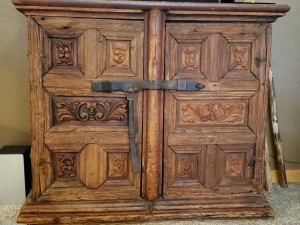 Identifying a Large Wooden Chest? - old carved two door wood chest with metal latch