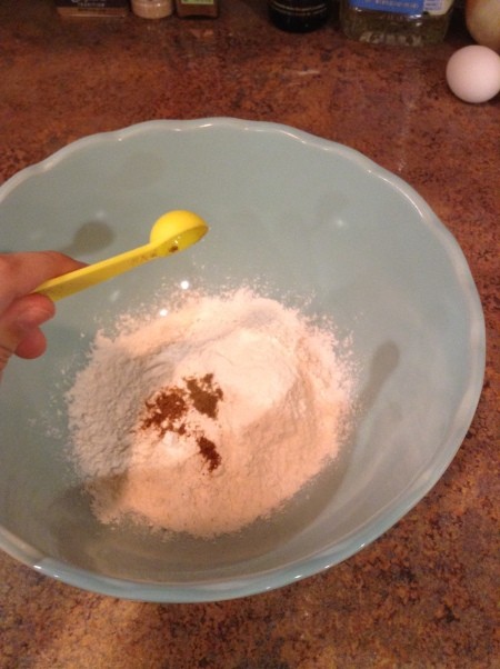 Adding spices to the flour.