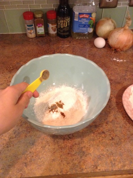Adding spices to the flour.