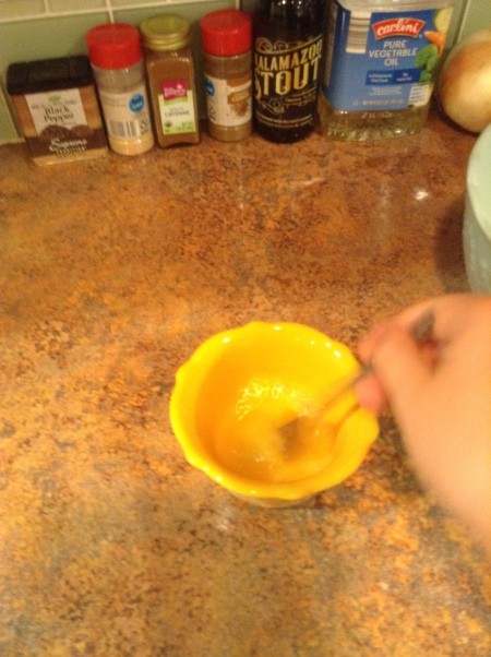 Mixing eggs in a bowl.