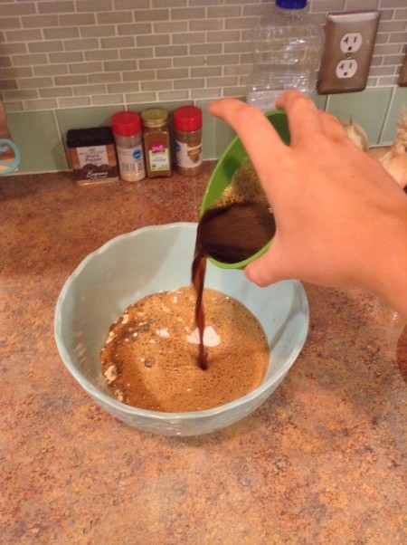 Adding beer to the flour mixture.