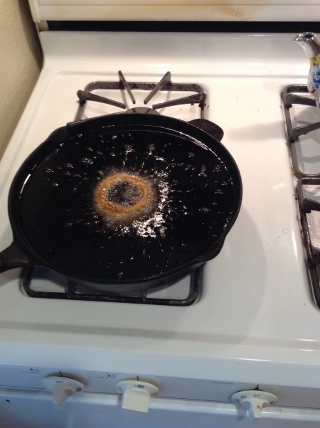 Frying onion rings in a cast iron pan.