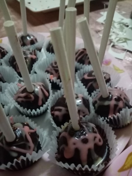 A plate of decorated cake pops.