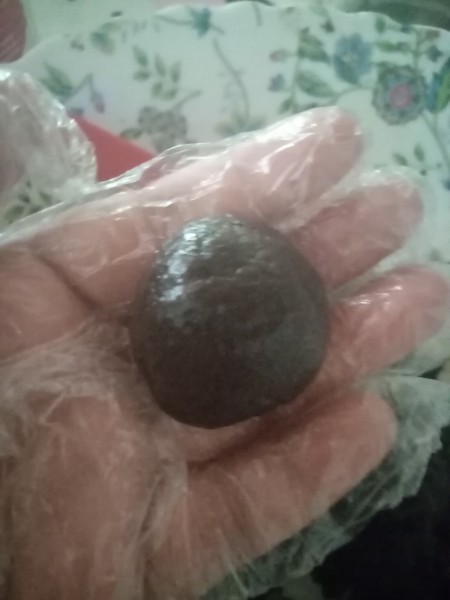 Rolling the cake pops into a ball.