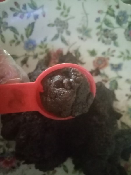 Scooping up a small amount of cake.