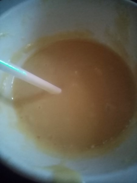 Dipping the cake pop into the topping.