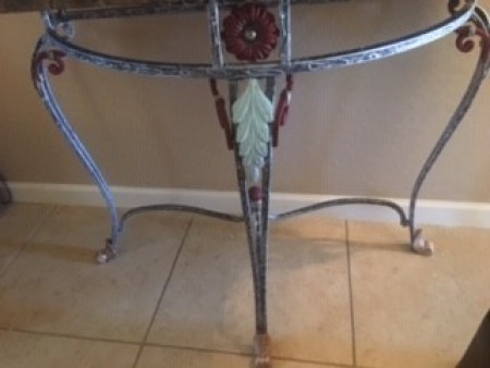 The wrought iron table after being painted.