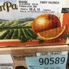 Two boxes of oranges with different pack dates.