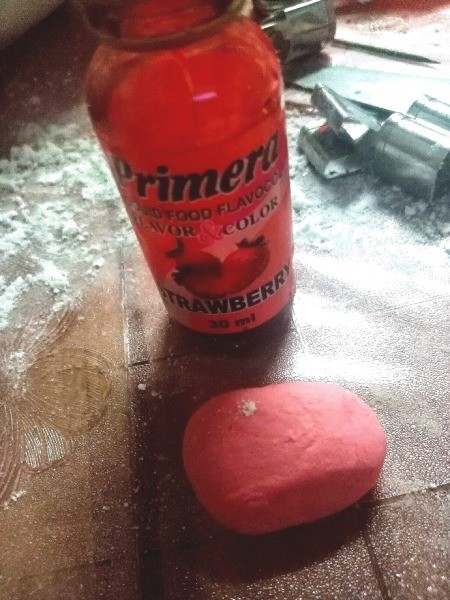 Mermaid Tail Cake Topper (Gumpaste) - divide and add food color to dough and roll into an oval