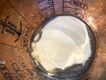 Adding gelatin to the bowl.