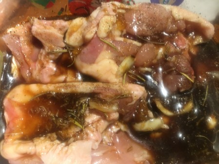 The chicken covered in marinade.