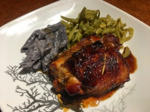 A plate of pomegranate rosemary chicken.