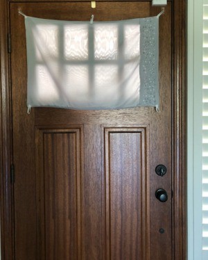 Hanging Window Door Covering - finished covering over the entry door window