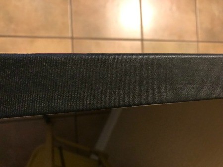 The wrapped edge of the canvas.