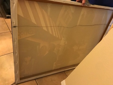 The back of the wrapped canvas frame.