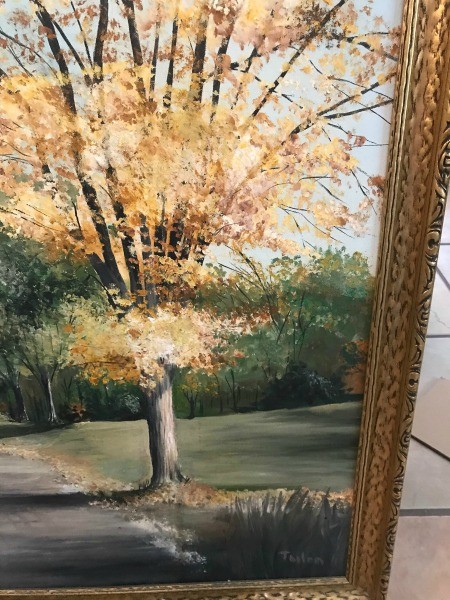 A painting of fall trees.