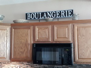 Farmhouse Style Signs - finished sign over the kitchen cabinets